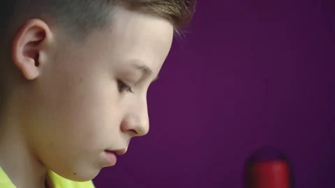 Little boy does homework, writes useful information. Slow Motion. Video stock 132057393