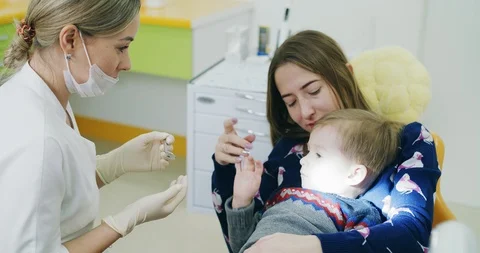 Little boy doesnt like to communicate with dentist doctor Stock Footage 92313701