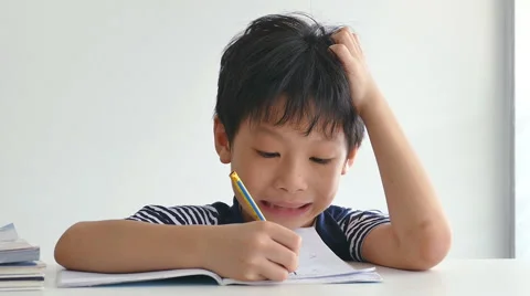 Little boy doing his homework Stock Footage 56882840