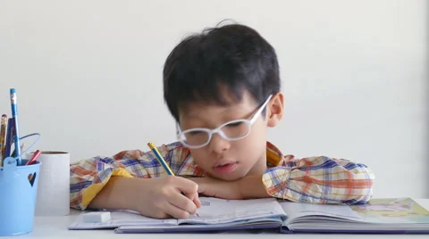 Little boy doing his homework Stock Footage 56896677