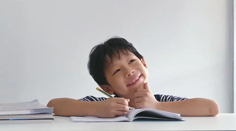 Little boy doing his homework Stock Footage 56897035