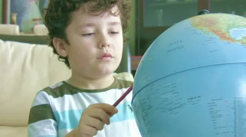 Little boy doing homework and smiling to camera 스톡 동영상 22306991