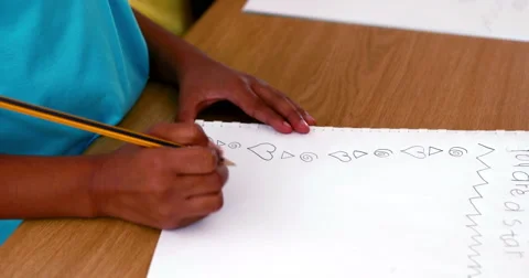 Little boy doodling in white notepad Stock Footage 40415354