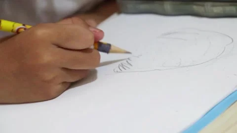 A little boy is drawing Stockbeeldmateriaal 243810905