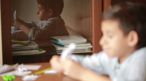Little boy drawing on paper art origami. hobby crafts Stock Footage