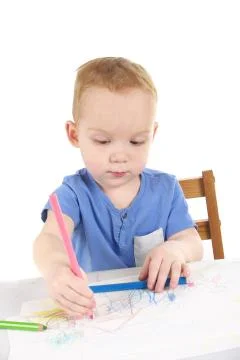 Little boy is drawing the picture Stock Photos
