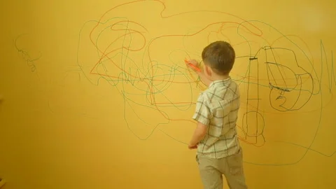 Little boy drawing on the wall at home Stock Footage 89905162