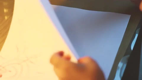 Little boy draws in notebook with colored pencils. Learning to draw. Stock Footage 219347901