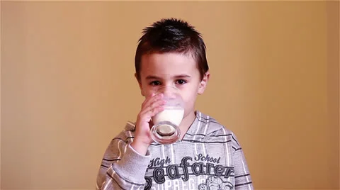 Little boy drinking milk Stock Footage 24664896