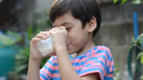 Little boy drinking milk Stockbeeldmateriaal 48608914