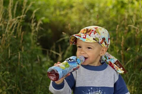 Little boy drinking Stock Photos