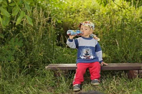Little boy drinking Stock Photos