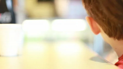 Little boy drinking at the restaurant Stock Footage 641220