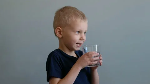 Little boy drinking water Stock Footage 104148242