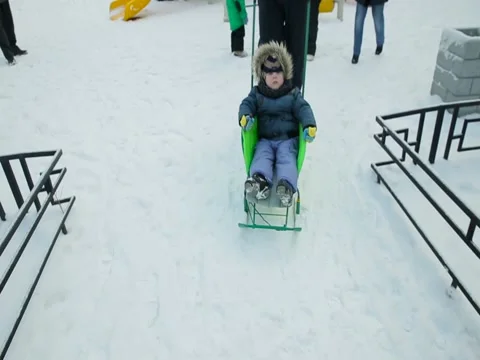 Little boy driven on the sledge in winter Stock Footage 73356728