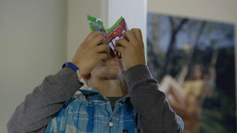 Little boy dropping fun dip into mouth Stock Footage 127959462
