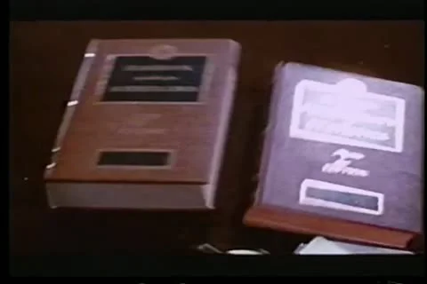 Little boy dropping stack of big books Stock Footage 11346228