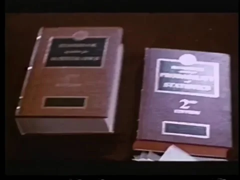 Little boy dropping stack of big books Stock Footage 260247635
