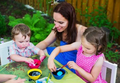 Little Boy Dyeing an Easter Egg Pink Stock Photos