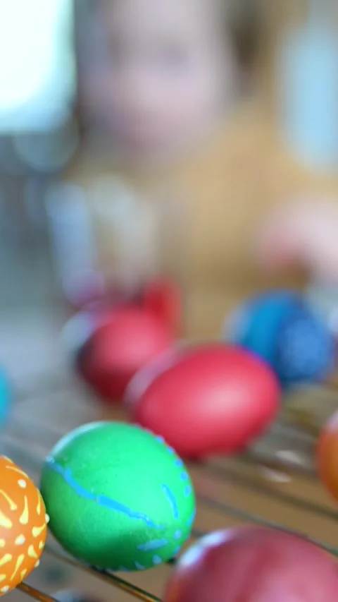 Little boy dyeing Easter eggs at home. Slow motion vertical footage. 스톡 동영상 304086978