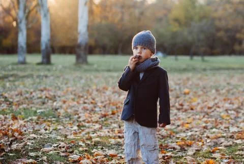 Little boy eating candy Stock Photos