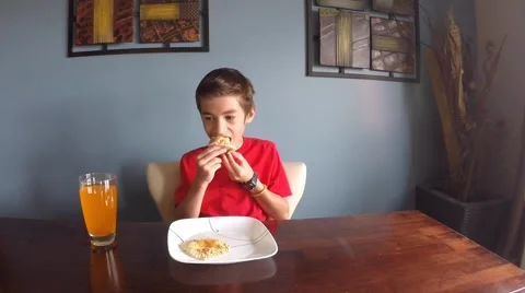 Little boy eating a muffin Video stock 40392913