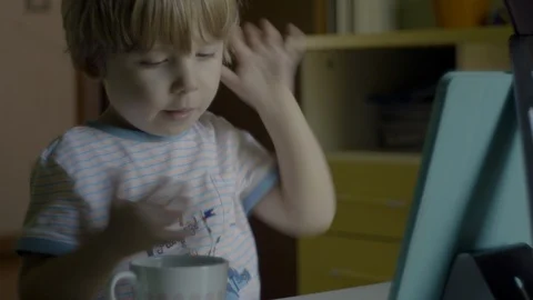 Little boy eating while watching digital tablet Stock Footage 119221514
