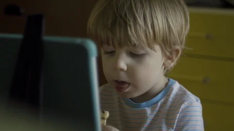 Little boy eating while watching digital tablet Stock Footage 119221681