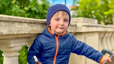A little boy eats a chocolate ice cream candy on a stick. Close-up of a his face Stock Photos