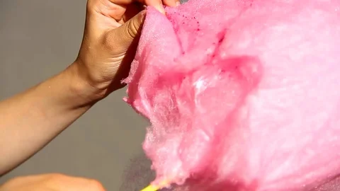 Little boy eats cotton candy at an amusement park. Video stock 117939716