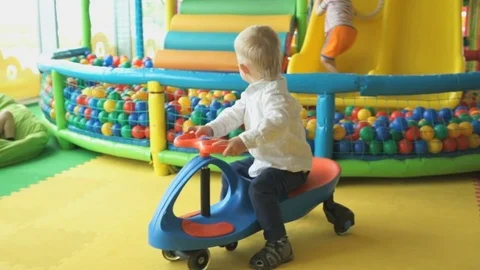 Little boy in an entertaining children's complex Stock Footage 80290978