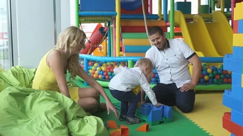 Little boy in an entertaining children's complex Stock Footage 80356717