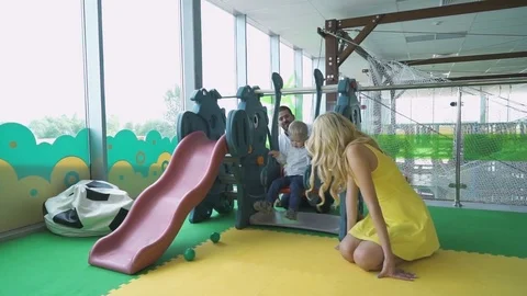 Little boy in an entertaining children's complex Stock Footage 81811681