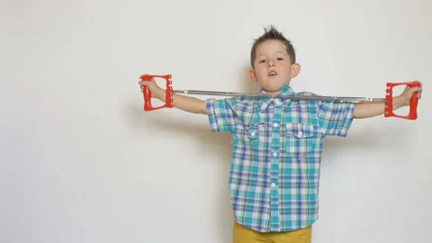 Little boy with expander on white background Stock Footage 93539682