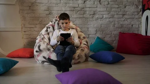 Little boy at expressive face using a digital tablet Stock Footage 76279946