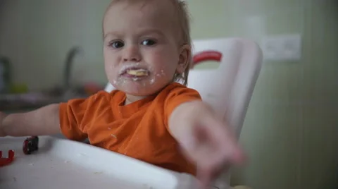 Little boy extends a hand in the kitchen 3  - Without color correction Stock Footage 55109968