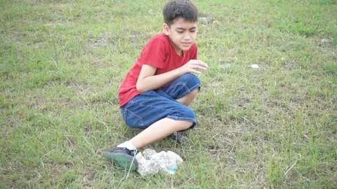 Little boy falling down on the ground lawn 스톡 동영상 101020580