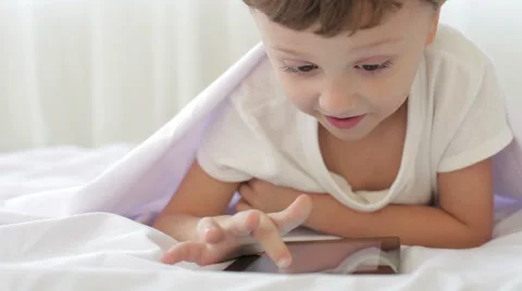 Little boy on the floor in the room using tablet Stock Footage 60442124