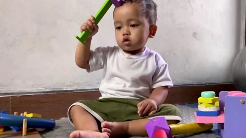 Little Boy Focused Playing With Educational Wooden Toys Stock Footage 329214923
