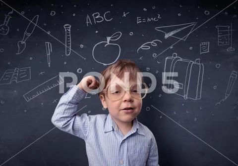 Little boy in front of a drawn up blackboard Stock Photos