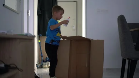 Little Boy Gluing Cardboard Box at Home 스톡 동영상 340337129