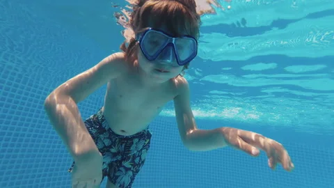 Little Boy In Goggles Diving, Swims Unde... | Stock Video | Pond5