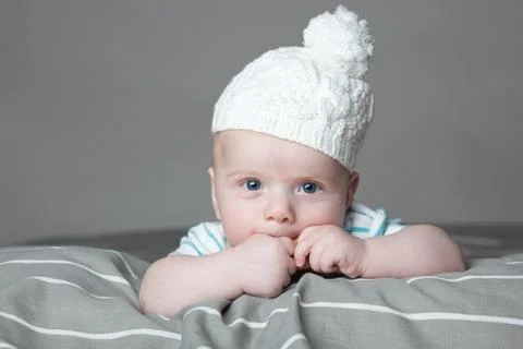 Little boy on a gray background Stock Photos