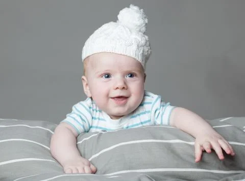 Little boy on a gray background Stock Photos
