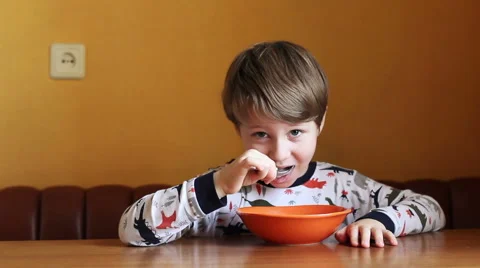 Little boy has breakfast. Video stock 64673640