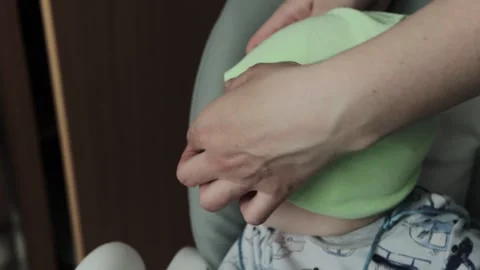 A little boy in a hat after applying a special oil to his hair against a Vídeo Stock 243161524