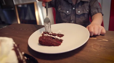 Little boy having cake at table Stock Footage 64454218