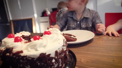 Little boy having cake at table Stock Footage 64454220