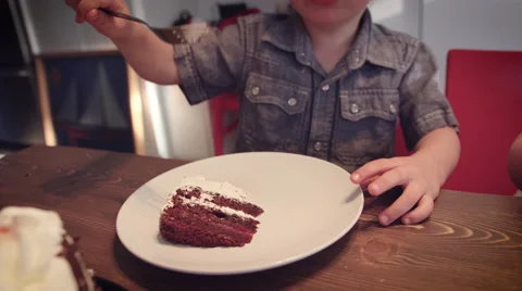Little boy having cake at table Stock Footage 64454268