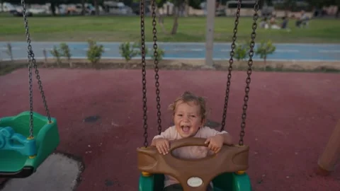 Little boy having fun on chain swing. The simple joys of childhood. 스톡 동영상 207844272